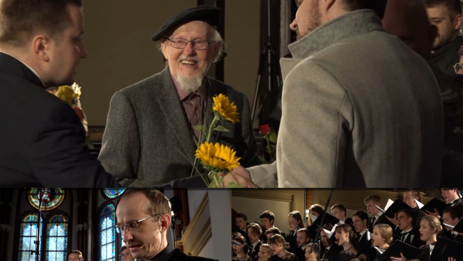 Epizodes no koncerta  "Amao Omi" Rīgas Domā - Knuts Skujenieks ar ziediem, aktieris Kaspars Znotiņš deklamē dzeju, koris izpilda dziesmu